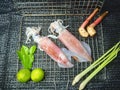 Fresh ink is placed on a stainless steel sieve. With kaffir lime leaves, lemongrass, lime, galangal. Royalty Free Stock Photo