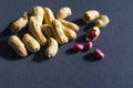 Fresh inshell peanuts on a dark surface Royalty Free Stock Photo