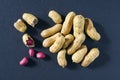 Fresh inshell peanuts on a dark surface Royalty Free Stock Photo