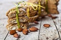 Fresh Italian cookies cantuccini stackes and almond seeds on ructic wooden table background
