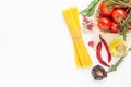 Fresh Italian Pasta Dish Ingredients. Ripe Red Tomatoes Rosemary Thyme in Wicker Basket Olive Oil in Bottle Spaghetti Hot Peppers Royalty Free Stock Photo