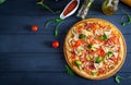 Fresh italian pizza with chicken fillet, mushrooms, ham, salami Royalty Free Stock Photo