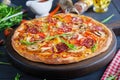 Fresh Italian pizza with chicken fillet, mushrooms, ham, salami Royalty Free Stock Photo