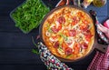 Fresh Italian pizza with chicken fillet, mushrooms, ham, salami, tomatoes Royalty Free Stock Photo