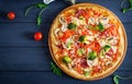 Fresh italian pizza with chicken fillet, mushrooms, ham, salami Royalty Free Stock Photo