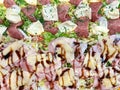 Fresh Italian pizza with ham, salami and cheese with green salad closeup Royalty Free Stock Photo