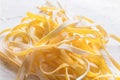 Fresh italian raw homemade pasta tagliatelle at wooden table. Italian food background Royalty Free Stock Photo