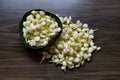 Fresh jasmine flowers in banana leaves bowl on wooden table for water spa. Royalty Free Stock Photo