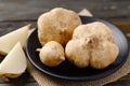 Fresh jicama or yam bean on black plate Royalty Free Stock Photo