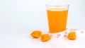 Fresh juice in glass and slide orange on white background Royalty Free Stock Photo