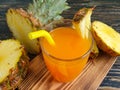 Fresh juice, pineapple wooden background detox organic