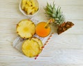 Fresh juice, pineapple wooden background organic