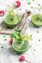 Fresh Juice Smoothie Made with Organic Greens, peas, cucumber, radish, spinach and lime. vertical image. top view Royalty Free Stock Photo