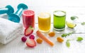 Fresh juices and gym equipment sport fitness healthy diet lifestyle concept