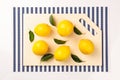 Fresh, juicy lemon on a kitchen cutting board made of artificial stone Royalty Free Stock Photo