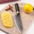 Fresh, juicy lemon on a kitchen cutting board made of artificial stone Royalty Free Stock Photo