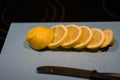 Fresh juicy lemon. Slice thin slices on a cutting board Royalty Free Stock Photo