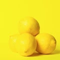 Fresh juicy lemon slides on a bright yellow background. Concept minimalism. Square frame Copy space.