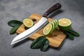 Fresh juicy lime. Slice thin slices on a cutting board.