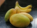 Fresh and juicy mangoes and bananas looking beautiful.