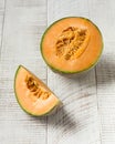 Fresh juicy melon on a light wooden background. Fruit Royalty Free Stock Photo