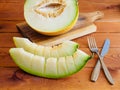 Fresh juicy melon on a wooden table background Royalty Free Stock Photo