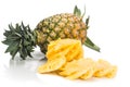 Fresh juicy nutritious cut pineapple with whole fruit as backgro Royalty Free Stock Photo