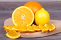 Fresh and juicy orange cut into pieces and lemon Royalty Free Stock Photo