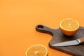 Fresh juicy orange halves on cutting Royalty Free Stock Photo