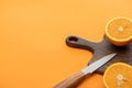 Fresh juicy orange halves on cutting Royalty Free Stock Photo