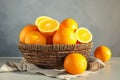 Fresh juicy oranges in wicker basket Royalty Free Stock Photo