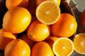 Fresh juicy oranges in wicker basket on table Royalty Free Stock Photo