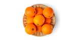 Fresh juicy oranges in wooden basket on white background Top view Royalty Free Stock Photo