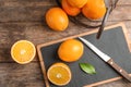 Fresh juicy oranges on wooden table Royalty Free Stock Photo