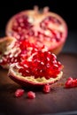 Fresh organic pomegranate on wooding cutting board