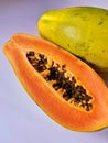 Fresh and juicy papaya, cut in half papaya, tasty and full of vitamins fruit, papaya seeds