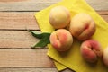 Fresh juicy peaches on yellow napkin Royalty Free Stock Photo