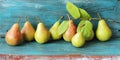 Fresh juicy pears, autumn leaves, on a wooden table Royalty Free Stock Photo