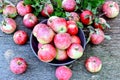 Fresh juicy pink apples on a wooden surface. Apple harvest.