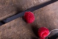 Fresh juicy raspberry on wooden plank