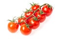 Fresh juicy red cherry tomato bunch closeup isolated on white background. Royalty Free Stock Photo