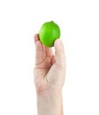 Fresh juicy tasty green lime in a human hand isolated on a white Royalty Free Stock Photo