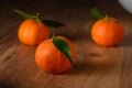 fresh juicy three tangerines on a wooden table 6