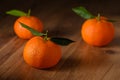 fresh juicy three tangerines on a wooden table 7