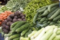 Fresh juicy vegetables, eggplant, cucumber, beans on a counter in the Indian market Goa