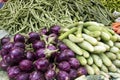 Fresh juicy vegetables, eggplant, cucumber, beans on a counter in the Indian market Goa Royalty Free Stock Photo