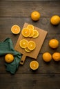 Fresh juicy vitamin oranges on wooden board. Food background. Vertical, top view