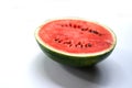 Fresh Juicy Watermelon half Slice on White Table. Royalty Free Stock Photo