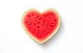 Fresh juicy watermelon slice heart shape isolated on white background