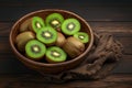 Fresh kiwi fruit arranged on rustic wooden background, juicy slices Royalty Free Stock Photo